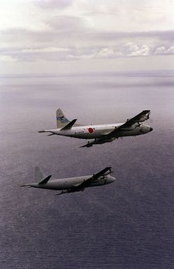 A Japanese P-3C Orion from Detachment 33, Japan Maritine Self Defense Force, Atsugi and an American P-3C from the Skinny Dragons of Patrol Squadron 4, Naval Air Station Barber's Point, Hawaii, part of the bilateral force during the exercise RIMPAC '98, patrol the ocean near Hawaii