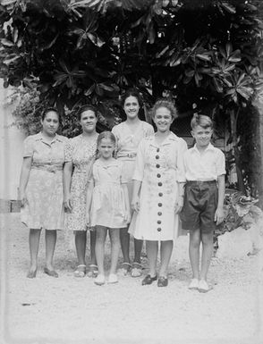 [Group portrait of four women and two children]