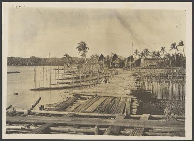 Village and boardwalk the waterfront, Kaimare, Papua New Guinea, ca. 1922 / Frank Hurley