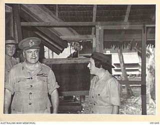 LAE, NEW GUINEA. 1945-05-11. GENERAL SIR THOMAS A. BLAMEY, COMMANDER-IN-CHIEF, ALLIED LAND FORCES, SOUTH WEST PACIFIC AREA (2), ACCOMPANIED BY LIEUTENANT COLONEL M.J. SPENCER, ASSISTANT CONTROLLER ..