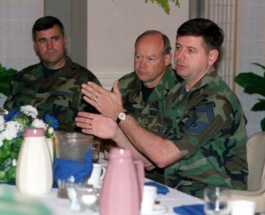 CHIEF MASTER SGT. of the Air Force David Campanale demonstrates his conversation with his hands during lunch with CHIEF MASTER SGT. Richardson, USPACOM, and CHIEF MASTER SGT. Brady, 15th Air Base Wing. Exact Date Shot Unknown