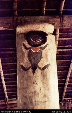 Wooden post with painted figure