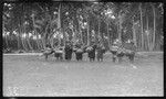 Women returning from gardens with food