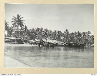 LABU, NEW GUINEA. 1944-10-03. A GENERAL VIEW OF THE CAMP OF THE 1ST WATERCRAFT WORKSHOPS. MANY VESSELS ARE TIED UP AT THE WHARF FOR REPAIRS