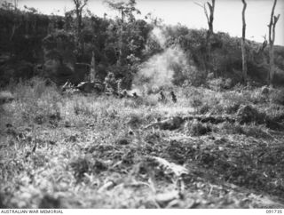 WEWAK AREA, NEW GUINEA, 1945-05-10. TROOPS OF 2/4 INFANTRY BATTALION, SUPPORTED BY 2/4 ARMOURED REGIMENT MATILDA TANKS, DURING THEIR ADVANCE AGAINST ENTRENCHED JAPANESE FORCES IN CAVES, TUNNELS AND ..