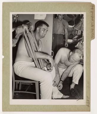 Photograph of Marine Lieutenant Donald Peiffer Being Treated By Coast Guardsman Clarence Conklin