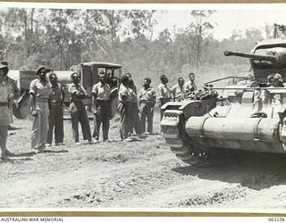 SOUTHPORT, QLD. 1944-01-18. NEW GUINEA POLICE BOYS WATCHING A DEMONSTRATION BY TROOPS OF THE 4TH ARMOURED BRIGADE IN A MATILDA TANK