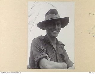 CAPE WOM, WEWAK, NEW GUINEA, 1945-07-29. WARRANT OFFICER 2 J.D. BLACKLEY AT 6 DIVISION RECEPTION CAMP. HE ENLISTED ORIGINALLY WITH THE 2/2 FIELD REGIMENT ON 1939-10-26 AND SERVED IN LIBYA, GREECE, ..