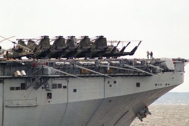 UH-1N Iroquois and CH-46 Sea Knight helicopters line the deck of the amphibious assault ship USS SAIPAN (LHA 2) during NATO Exercise NORTHERN WEDDING '86