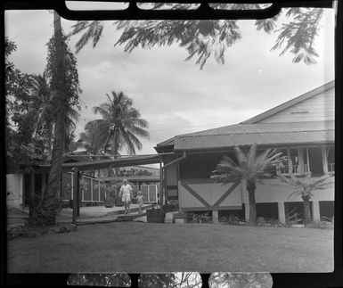 Unidentified man and child outside the [Northern Hotels?], Ba, Fiji