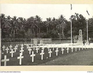 FINSCHHAFEN, NEW GUINEA, 1944-02-29. THE OFFICIAL OPENING OF THE FINSCHHAFEN WAR CEMETERY BY VX20308 MAJOR-GENERAL F.H. BERRYMAN, CBE, DSO, OFFICER COMMANDING 2ND AUSTRALIAN CORPS, WHO UNVEILED THE ..