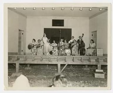 [Hula Dancer Performs on Stage]