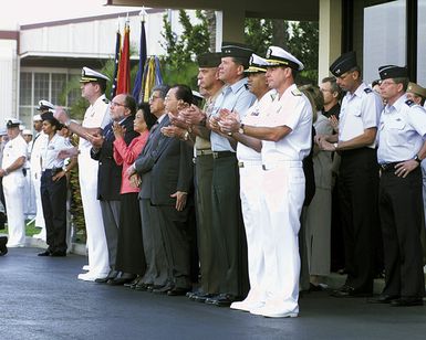 Admiral (ADM) Thomas Fargo, USN, Commander Pacific Fleet and other by senior military officials and civilian leaders applauds the arrival of crew members from the USN EP-3 Aries II aircraft involved in the March 31st accident with a Chinese F-8 aircraft, as they arrive at Hickam Air Force Base, Hawaii