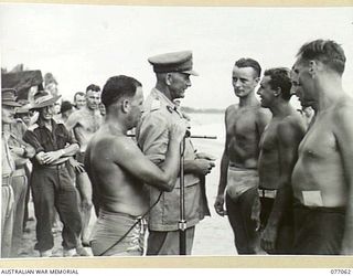 TOROKINA, BOUGAINVILLE, 1944-11-19. VX38969 MAJOR-GENERAL W. BRIDGEFORD, CBE, MC, GENERAL OFFICER COMMANDING 3RD DIVISION PRESENTING PRIZES TO THE MEMBERS OF THE ROYAL NEW ZEALAND AIR FORCE SURF ..