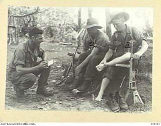 HANSA BAY-BOGIA HARBOUR AREA, NEW GUINEA. 1944-08-01. TROOPS OF A TWO MAN PATROL OF THE 30TH INFANTRY BATTALION WHICH HAS JUST RETURNED FROM THE UPPER REACHES OF THE SEPIK RIVER MASSAGING THEIR ..