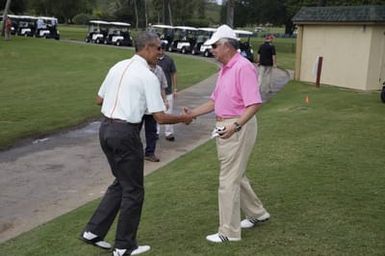 Barack Obama and Prime Minister Najib Razak of Malaysia before they play golf in Kaneohe Bay, Hawaii, December 24, 2014