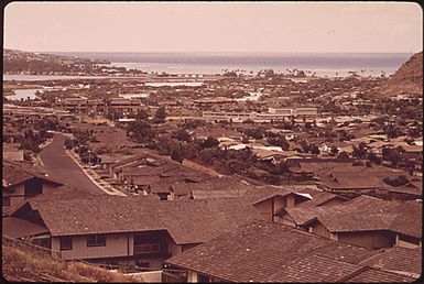 HAWAII-KAI, BUILT ON A SWAMP AND A HILLSIDE, IS A FAST-GROWING AREA EAST OF DOWNTOWN HONOLULU. SCARCITY OF LAND AND SKYROCKETING COSTS ARE FAVORING CONSTRUCTION OF TOWN HOUSES AND HIGH-RISE APARTMENTS OVER THE ONCE DOMINANT SINGLE-FAMILY UNITS