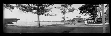 View in Samoa [probably in Apia], showing a waterfront avenue