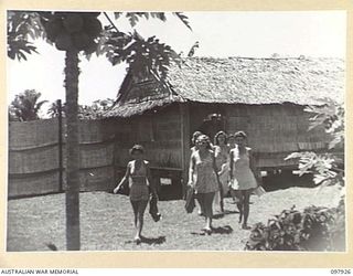 LAE, NEW GUINEA. 1945-10-20. THE AUSTRALIAN NEW GUINEA ADMINISTRATIVE UNIT SWIMMING POOL IS THE MOST POPULAR AMENITY PROVIDED FOR AUSTRALIAN WOMEN'S ARMY SERVICE PERSONNEL IN THE LAE AREA. WATER ..