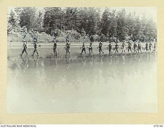 HANSA BAY-BOGIA HARBOUR, NEW GUINEA. 1944-08-09. TROOPS OF NO. 13 PLATOON, C COMPANY, 30TH INFANTRY BATTALION MOVING ALONG THE BEACH NEAR THE MOUTH OF THE RAMU RIVER TO TAKE UP THEIR NEW POSITIONS. ..