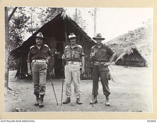 ULEBILUM, NEW GUINEA, 1945-07-10. BRIGADIER M.J. MOTEN, COMMANDING OFFICER, 17 INFANTRY BRIGADE (1), WITH LIEUTENANT-COLONEL J.A. BISHOP, HEADQUARTERS 6 DIVISION (2) AND LIEUTENANT-COLONEL A.W. ..