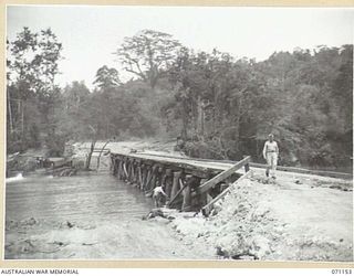 MAPE RIVER, NEW GUINEA, 1944-03-15. THE NO.2 PILE- BENT, ONE WAY BRIDGE, WITH A LENGTH OF 320 FEET, WAS BUILT BY THE 870TH UNITED STATES AVIATION ENGINEERS BATTALION IN SIX DAYS