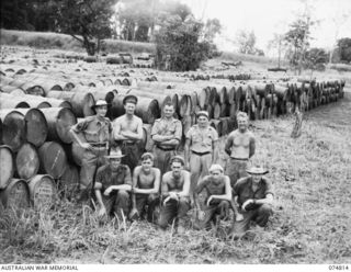 NADZAB, NEW GUINEA. 1944-07-21. PERSONNEL OF THE 39TH LINES OF COMMUNICATION SALVAGE SECTION AND THE 2ND CORPS SALVAGE DEPOT, ATTACHED TO THE 8TH SALVAGE DEPOT. IDENTIFIED PERSONNEL ARE:- TX15496 ..