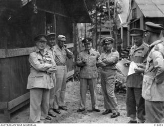 TOROKINA, BOUGAINVILLE. 1945-09-08. LIEUTENANT-GENERAL (LT-GEN) S. G. SAVIGE, GENERAL OFFICER COMMANDING 2 COPRS, ACCEPTED THE SURRENDER OF ALL JAPANESE FORCES ON BOUGAINVILLE FROM LT-GEN M. KANDA, ..