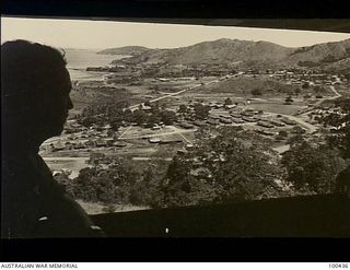 Port Moresby, New Guinea. 1944-05-09. An elevated view from the mess room window of Commander, Royal Engineers, First Australian Army Troops. From here can be seen Calamity Corner, Paga Point, and ..