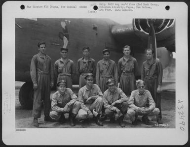 Lt. Spencer and crew of the 403rd Bomb Squadron, 43rd Bomb Group, pose beside their Consolidated B-24 "Liberator" at Dobodura Airstrip, Papua, New Guinea. (U.S. Air Force Number 72379AC)