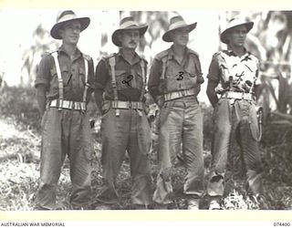 MADANG, NEW GUINEA. 1944-06-30. OFFICERS OF A COMPANY, 24TH INFANTRY BATTALION. IDENTIFIED PERSONNEL ARE:- VX54060 LIEUTENANT J. LAUGHLIN, COMMANDING NO. 7 PLATOON (1); NX57168 LIEUTENANT C.J. ..