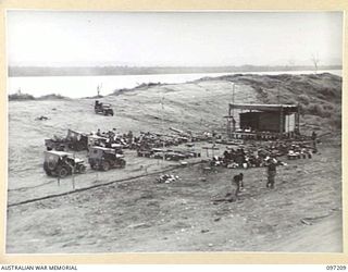 WEWAK POINT, NEW GUINEA. 1945-09-28. A GENERAL VIEW OF THE THEATRE ERECTED AT HEADQUARTERS 6 DIVISION. PREPARATIONS ARE BEING MADE FOR A PERFORMANCE BY THE DARYA COLLIN BALLET TROUPE