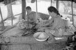 Fefiloi Muti and her father, Uili in the cook-house