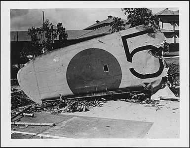 Photograph of a wing from a Japanese bomber shot down on the grounds of the Naval Hospital, Honolulu, Territory of Hawaii, during the attack on Pearl Harbor