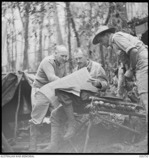 MAJOR-GENERAL A.S. ALLEN, CB., CBE., DSO., VD., GENERAL-OFFICER-COMMANDING 7TH AUSTRALIAN DIVISION (LEFT) AND BRIGADIER K.W. EATHER, COMMANDING 25TH AUSTRALIAN INFANTRY BRIGADE, (CENTRE). THEY WERE ..