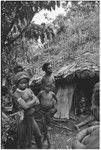 Dispute in Tuguma: men discuss garden damage done by a neighboring group's pig