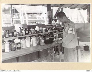 MASAMASA ISLAND, SOLOMON ISLANDS. 1945-11-14. JAPANESE PHARMACISTS AT WORK IN THE DISPENSARY AT THE HOSPITAL. JAPANESE ARMY AND NAVAL TROOPS ARE CONCENTRATED ON FAURO ISLAND UNDER THE CONTROL OF 7 ..