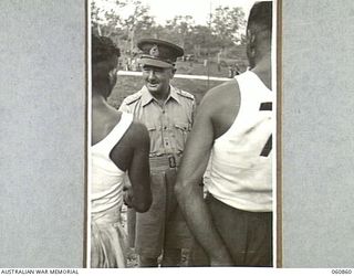 NEW GUINEA. 1943-11-20. NX8 LIEUTENANT GENERAL SIR LESLIE MORSHEAD KCB KBE CMG DSO ED, GENERAL OFFICER COMMANDING, NEW GUINEA FORCE CONGRATULATING WINNERS OF THE VARIOUS EVENTS AT THE CHAMPIONSHIP ..