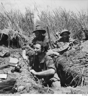 NEW GUINEA. AUSTRALIAN TROOPS IN HASTILY CONSTRUCTED TRENCHES ON THE GONA PERIMETER