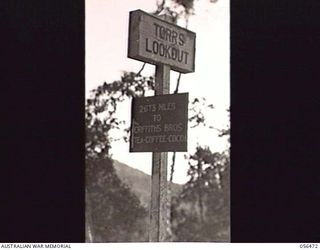 REINHOLD HIGHWAY, NEW GUINEA, 1943-08-24. NOTICE ON THE ROADSIDE AT TORR'S LOOKOUT, ABOUT FOUR MILES FROM EDIE CREEK