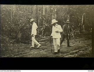 Kabakaul, New Britain. c. 1915. Senior army officers consider the siting of a trench on the Kabakaul to Bitapaka Road