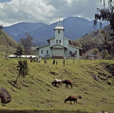 Kegsugl Roman Catholic Mission church and slopes of Mount Wilhelm, Chimbu Province, Papua New Guinea, approximately 1968 / Robin Smith