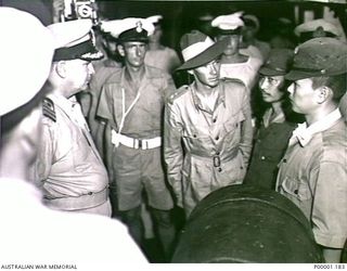 THE SOLOMON ISLANDS, 1945-08-20. ALLIED AND JAPANESE SERVICE PERSONNEL ABOARD HMAS LITHGOW OFF MOILA POINT HOLD DISCUSSIONS CONCERNING PREPARATIONS FOR AN OFFICIAL SURRENDER CEREMONY AT TOROKINA. ..