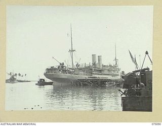 MADANG, NEW GUINEA. 1944-08-06. THE AUSTRALIAN MV. "MERKUR" BERTHED AT THE NEW WHARVES BUILT BY MEMBERS OF THE ROYAL AUSTRALIAN ENGINEERS