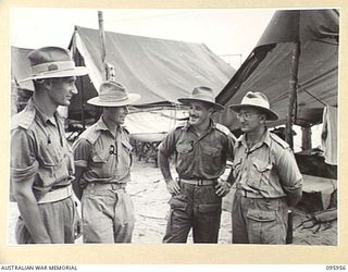 BORAM BEACH, WEWAK AREA, NEW GUINEA. 1945-08-31. SENIOR OFFICERS OF 2/15 FIELD AMBULANCE WITH THEIR COMMANDING OFFICER LIEUTENANT COLONEL A.C. MENDELSOHN (3)