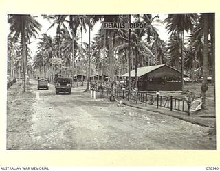 MILNE BAY SUB AREA, NEW GUINEA, 1944-02-09. THE ENTRANCE TO THE RECEPTION AND GENERAL DETAILS DEPOT. THE ORDERLY ROOM LIES ON THE RIGHT