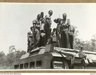 SOUTHPORT, QLD. 1944-01-18. NEW GUINEA NATIVE POLICE BOYS INSPECTING A MATILDA TANK AT THE 4TH ARMOURED BRIGADE HEADQUARTERS