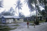 Federated States of Micronesia, boys outside village homes in Chuuk State