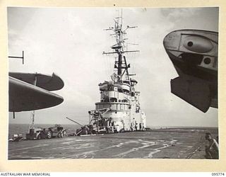 AT SEA OFF RABAUL, NEW BRITAIN. 1945-09-06. THE FLIGHT DECK OF THE AIRCRAFT CARRIER HMS GLORY WHERE THE SURRENDER CEREMONY BETWEEN LIEUTENANT GENERAL V.A.H. STURDEE, GENERAL OFFICER COMMANDING ..