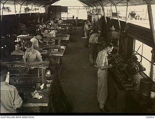 Port Moresby, New Guinea. 1944-05-30. Interior of the rifle re-conditioning shop of 11 Advanced Workshop, Australian Electrical and Mechanical Engineers (AEME), at Watkins Acre